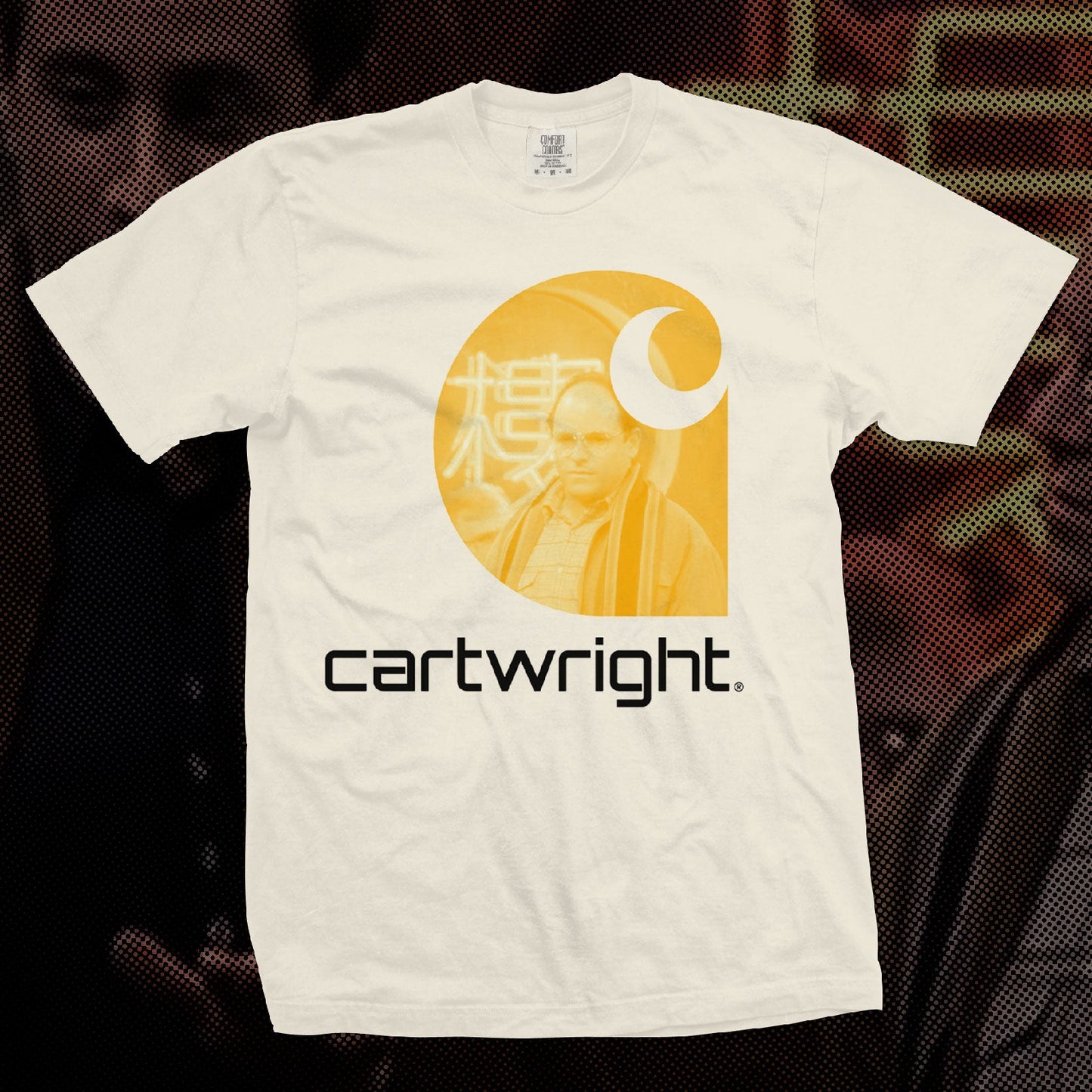 White t-shirt with yellow graphic and 'cartwright' text on a dark background