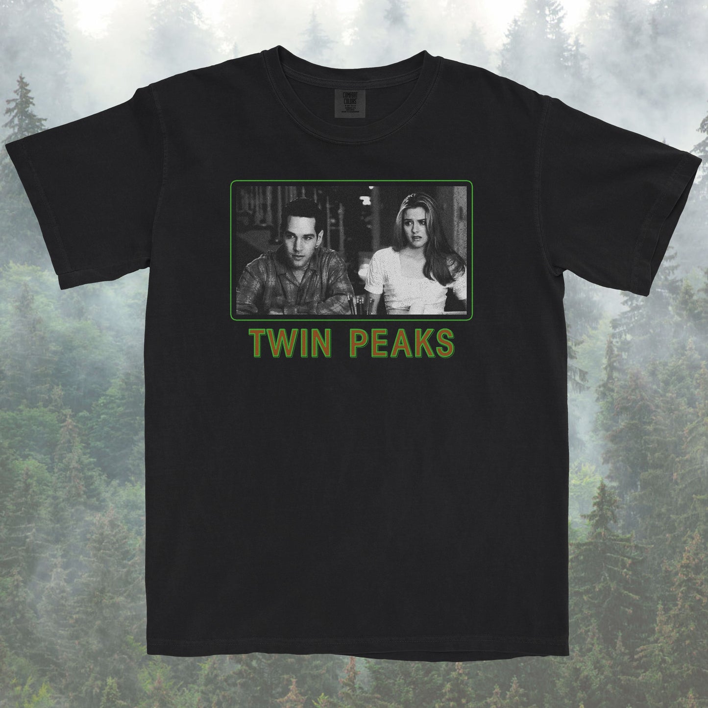 Black t-shirt with Twin Peaks graphic design on a forest background
