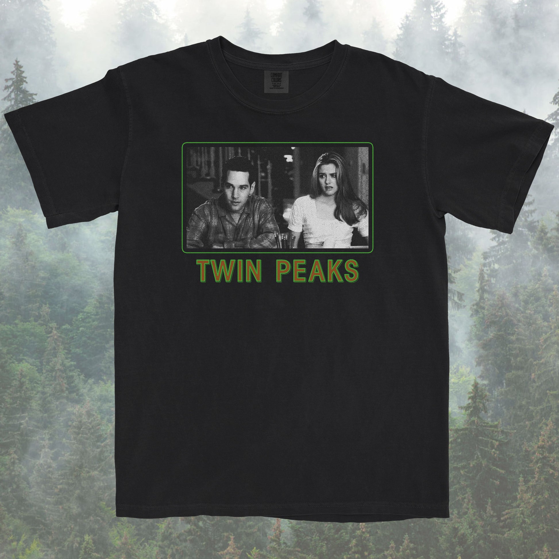 Black t-shirt with Twin Peaks graphic design on a forest background